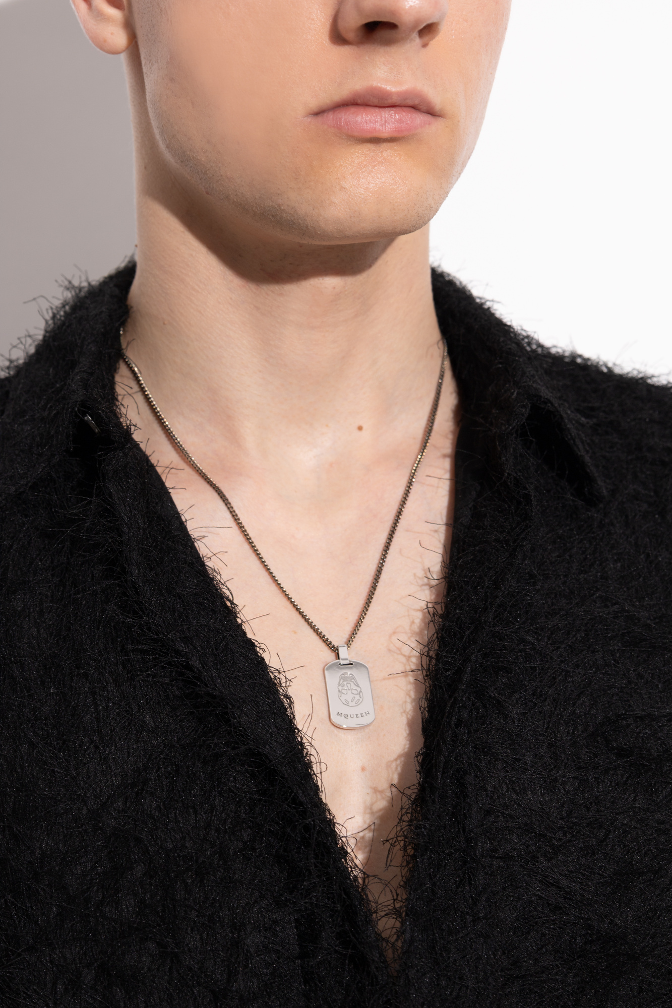 Silver Necklace with a pendant featuring an engraved logo
